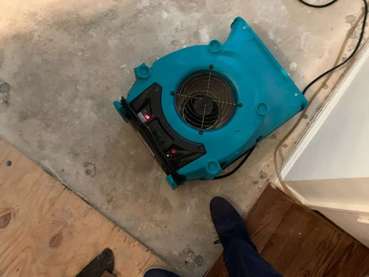 Air mover drying subfloor during Commercial Water Damage Restoration in Colebrookdale